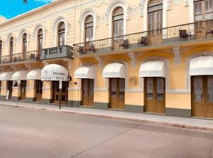 a building on the side of a street at Boutique Hotel Belgica in Ponce