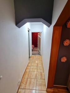 a hallway of a room with white walls and a ceiling at Urban Nest Barlad in Bîrlad