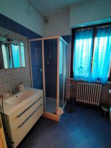 a bathroom with a shower and a sink at La Magnolia - Fano in Fano