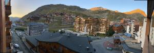 a view of a city with buildings and a mountain at Val Thorens - Confortable Appartement 4 personnes in Val Thorens
