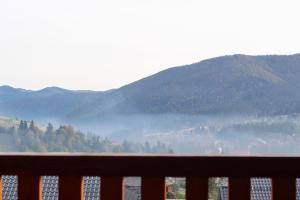 a view from a balcony of a mountain range at Котедж "Валерія" in Vorokhta
