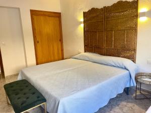 Postel nebo postele na pokoji v ubytování CHINASOL Low Cost