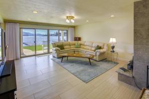 a living room with a couch and a table at Waterfront Newport Home with Private Boat Dock! in Newport