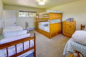 a bedroom with a bunk bed and two beds at Waterfront Newport Home with Private Boat Dock! in Newport