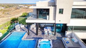 an aerial view of a house with a swimming pool at Blue Star Meloneras Villa in San Bartolomé de Tirajana