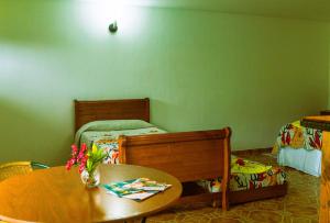 Un ou plusieurs lits dans un hébergement de l'établissement Hostal y Cabañas Aorangi