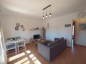 a living room with a couch and a table at Villardilla Fuerteventura in La Oliva