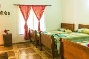Un ou plusieurs lits dans un hébergement de l'établissement Hostal y Cabañas Aorangi
