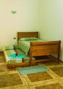 Un ou plusieurs lits dans un hébergement de l'établissement Hostal y Cabañas Aorangi