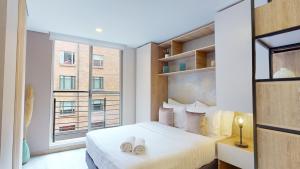 Letto o letti in una camera di The Cabrera Eighty Fifth Hotel