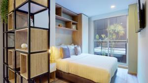 Letto o letti in una camera di The Cabrera Eighty Fifth Hotel