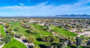 an aerial view of a golf course with mountains in the background at A Few Steps To Heated Pool, Tennis, Bike Trail in Scottsdale