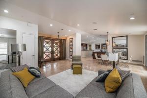 a living room with a couch and a dining room at Private Executive Home, Pet Friendly, Walkable in Scottsdale