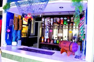 a bar with a barrel in front of a bar at The Regency Hotel in Blackpool