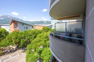 a balcony of a building with a view of a street at L'Espace Détente - GEM / GARE in Grenoble