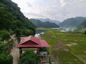 a view of a valley with a river and mountains at Trần Thực homestay-Ba bể in Ba Be18