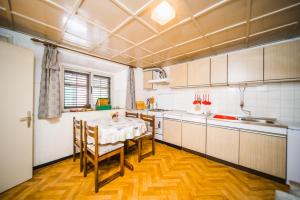 a kitchen with a table and chairs in it at Holiday house in Zrnovo with terrace, air conditioning, WiFi 3709-2 in Žrnovo