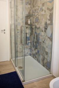 a shower with a glass door in a bathroom at B&B Zvana's - Da Giovanna in Imola +26 photos