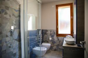 a bathroom with a toilet and a sink and a shower at B&B Zvana's - Da Giovanna in Imola