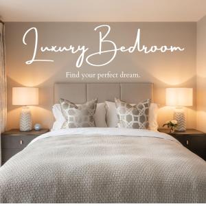 a bedroom with a bed and a sign that reads every bedroomfind your perfect dream at The Orchard, 5 Star Luxury Accommodation in Newcastle