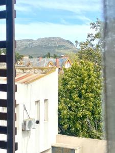 a view from the window of a building at FINCA NOVA Apartment 4 in Balcarce +3 photos