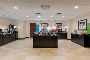 a lobby of a store with counters and a pharmacy at Hampton Inn Atlanta McDonough in McDonough