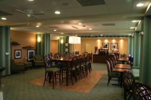 a dining room with a table and chairs at Hampton by Hilton in Brentwood