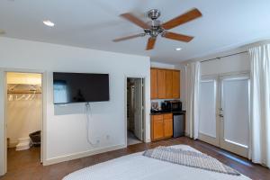 a bedroom with a bed and a ceiling fan at Casablanca 1 in Houston