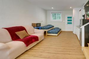 a living room with two couches and a tv at Shelby Vacation Rental Close to Parks and Trails! in Shelby