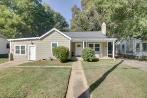 a small white house with a driveway at Shelby Vacation Rental Close to Parks and Trails! in Shelby
