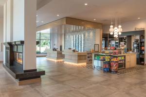 a grocery store with a large lobby at Hilton Garden Inn Boston Canton, Ma in Canton +34 photos