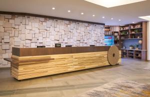 a store lobby with a reception desk in a store at Hilton Appleton Paper Valley in Appleton