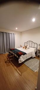 a bedroom with a bed and a rug at Quinta Sol II Sea in Camacha