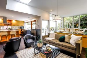 a living room with a couch and a table at Stylish Seattle Vacation Rental with Water View in Seattle