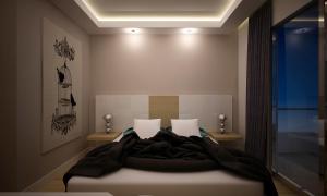a bedroom with a bed with a black blanket at Amore Hotel Teki̇rova in Tekirova