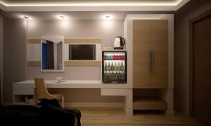 a room with a drink refrigerator and a counter at Amore Hotel Teki̇rova in Tekirova