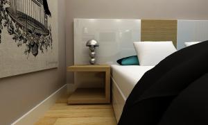a bedroom with a bed and a side table at Amore Hotel Teki̇rova in Tekirova