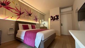 Ein Bett oder Betten in einem Zimmer der Unterkunft SAN LORENZO Luxury Boutique