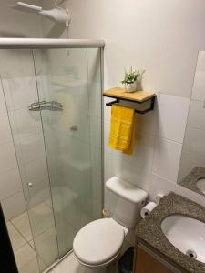 a bathroom with a shower and a toilet and a sink at AP 102-B San Pietro - Térreo in Palmas