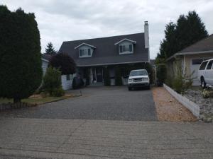 a car parked in the driveway of a house at Sweet Boutique Suite in Langley
