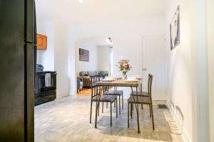 a kitchen and dining room with a table and chairs at Cozy Retreat in Downtown Lancaster with Backyard Patio in Lancaster