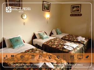 Giường trong phòng chung tại Hostal Turismo Cruz de Piedra EIRL-Cajamarca