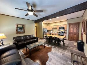 a living room with a couch and a table at Yellowstone Cabins and RV in West Yellowstone