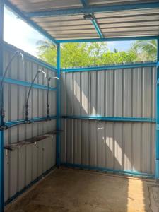 an empty garage with a large metal wall at Redang Campstay in Redang Island