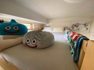 a bedroom with two large pillows on a bed at Daikanyama 41 VALUE ADD Apartments in Tokyo