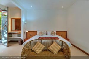 Postel nebo postele na pokoji v ubytování Jixiang Hotel Ubud