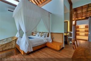 Postel nebo postele na pokoji v ubytování Jixiang Hotel Ubud