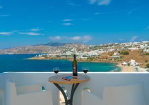 a view from a balcony of a beach with a view of the ocean at Cape Mykonos in Mikonos