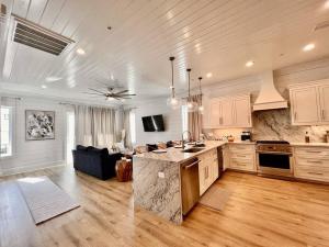 a large kitchen with a large island in a room at Osprey -Luxury 3BDR Beach House in Orange Beach