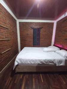 Rúm í herbergi á Agora Home